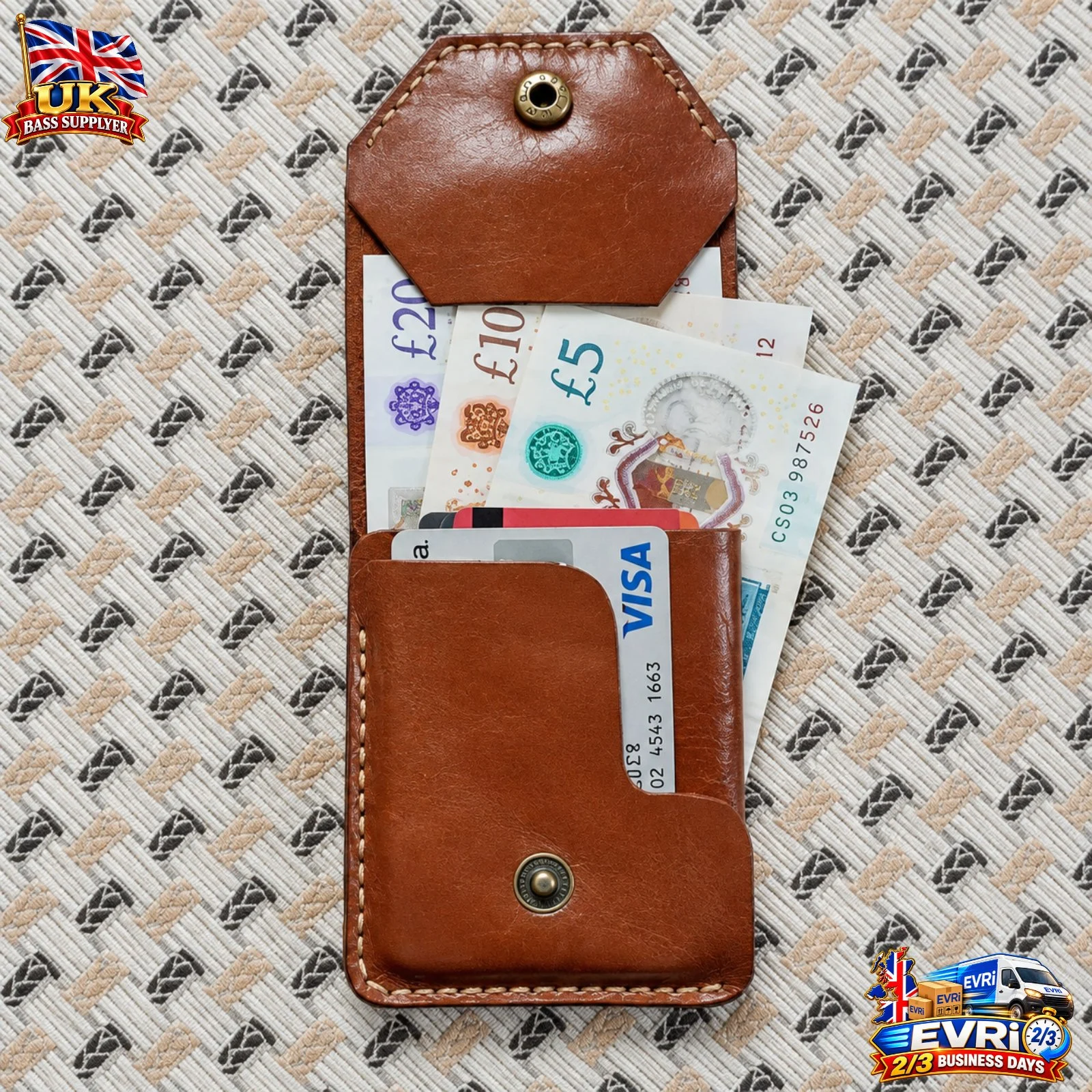 Handmade brown leather snap wallet with brass snap button on patterned fabric